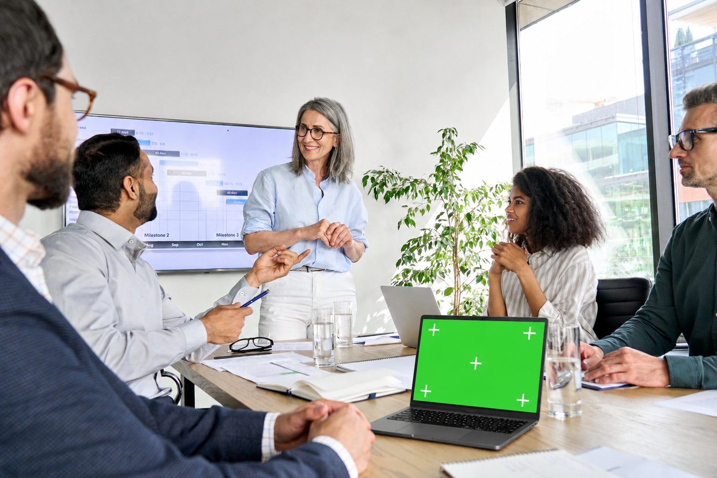 A person reviewing figures on screen.